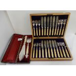 A lot comprising a cased twenty four piece fish cutlery set and a cased pair of EP fish servers