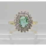 A 9ct gold emerald and diamond ring, emerald approx 6mm x 4.5mm x 2.7mm, finger size L, weight 2.