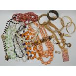 A bag full of vintage costume jewellery to include millefiori beads Condition Report: Available upon