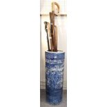 A Chinese blue and white stickstand together with a silver topped walking stick and four other