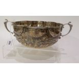 A twin handled silver bowl assayed by The London Assay Office 1968, of circular form with