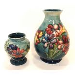 Two Moorcroft Spring Flowers vases, 16cm and 9cm high Condition Report: lightly crazed.