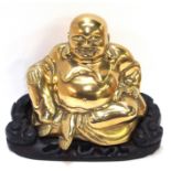 A Chinese polished brass seated Buddha, on fitted wood stand, 22cm high overall Condition Report: In