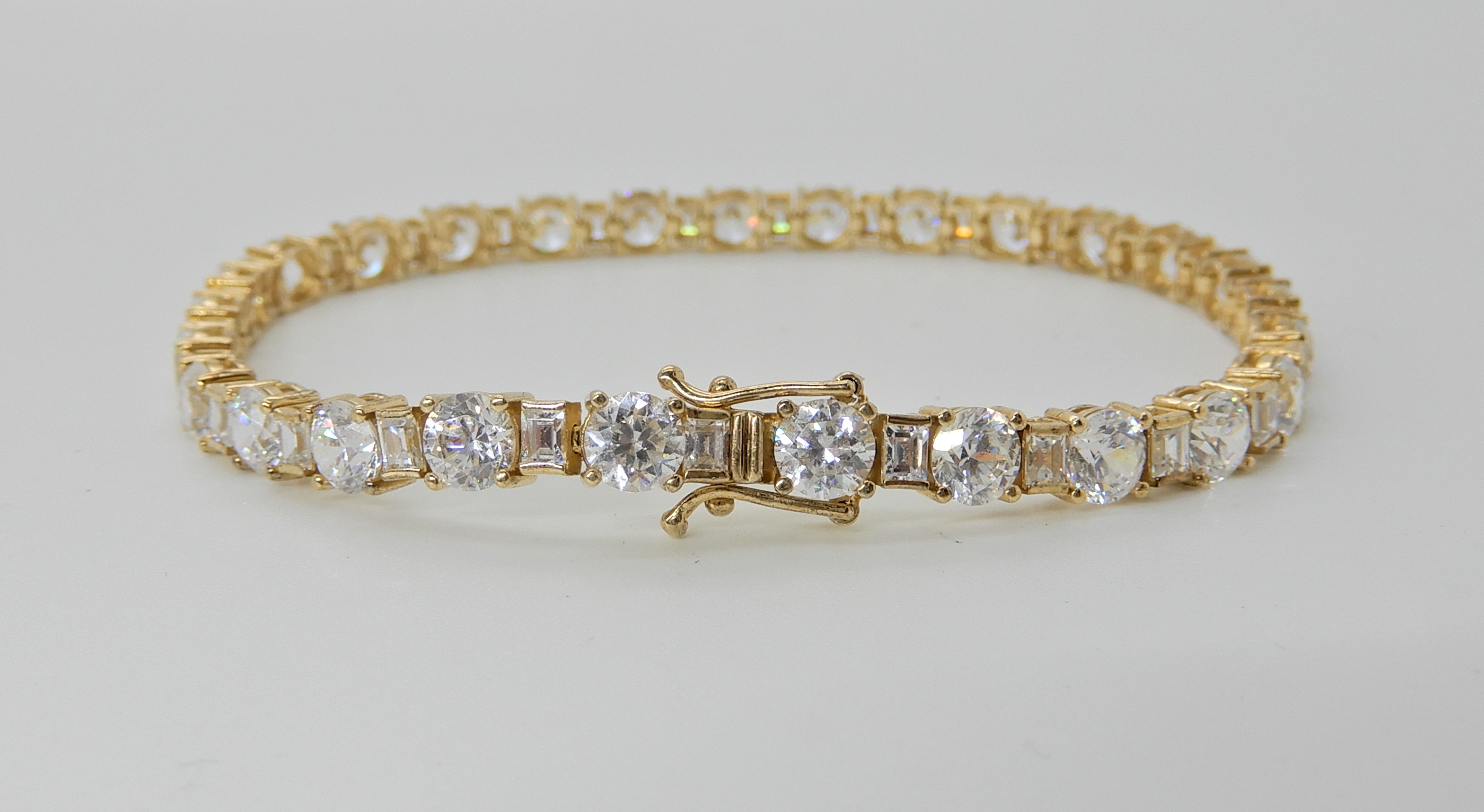 A 14k gold cubic zirconia line bracelet, by QVC, length 18.5cm, weight 13gms Condition Report: Light