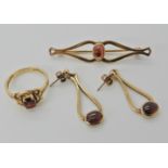 A collection of 9ct gold and garnet items made by R. Grant Logan of Campbeltown to include a