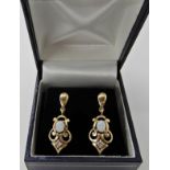 A pair of 9ct gold opal and diamond drop earrings length 2.8cm, weight 2.6gms Condition Report: