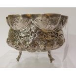 A Burmese white metal bowl depicting forest scenes with Elephants and other animals standing on