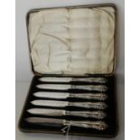 A cased set of six silver handled fruit knives, Sheffield marks Condition Report: Available upon