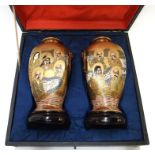 A pair of Japanese Satsuma vases, with wood stands, in original case, vase 15.5cm high Condition