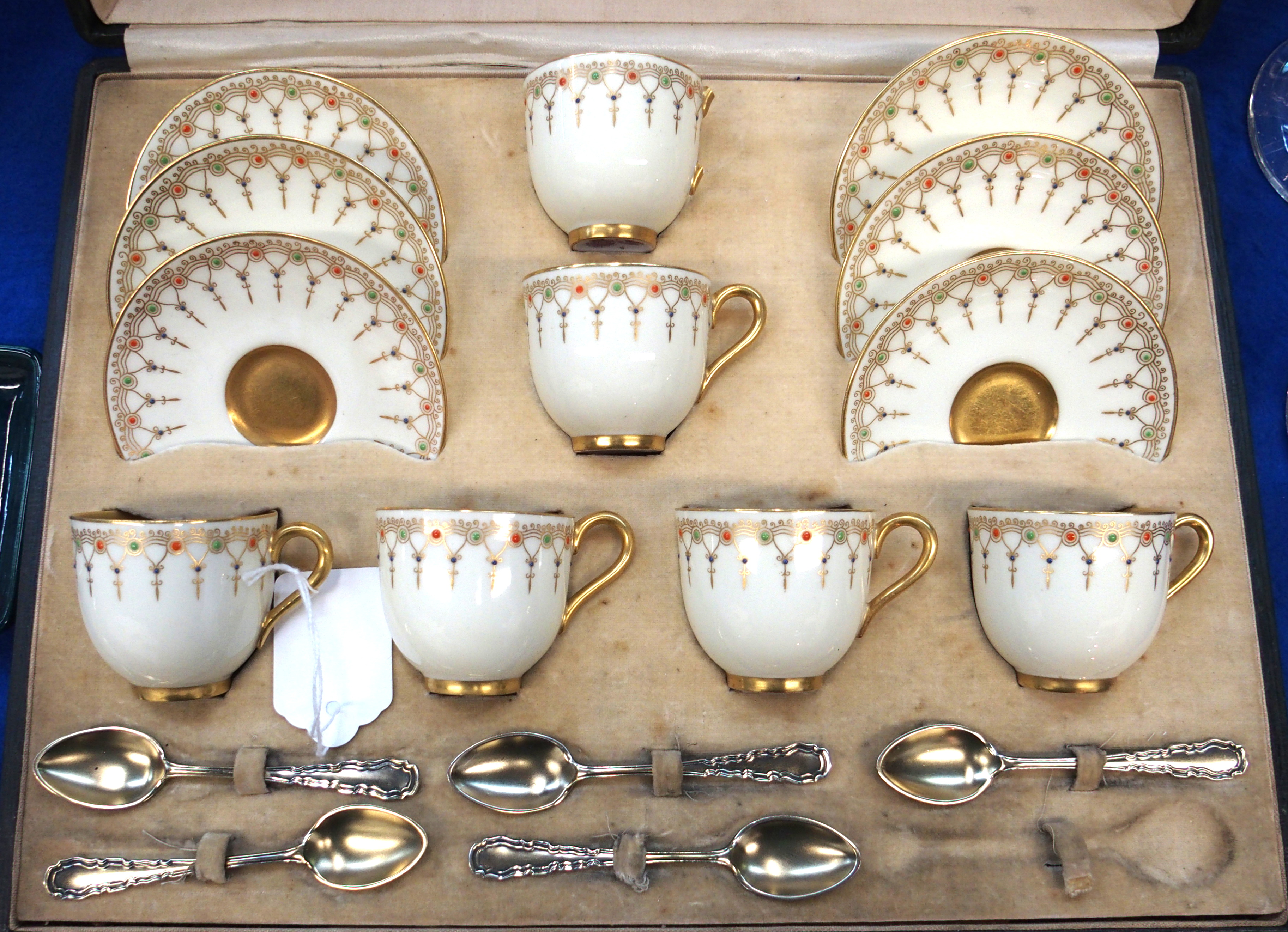 A Royal Worcester demitasse coffee cups and saucers, the cream ground with gilt detail and orange, - Image 2 of 2