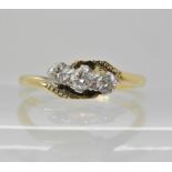 An 18ct gold three stone diamond ring of estimated approx 0.25ct, size M, weight 2.6gms Condition