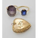 A 9ct gold large faux amethyst ring size O1/2, a 9ct blue glass set ring, size P, and a heart shaped
