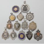 Fourteen silver and white metal medallions Condition Report: Available upon request