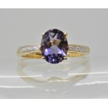 A 9ct gold sapphire and diamond accent ring by QVC, size U1/2, sapphire approx 9mm x 7mm x 4.7mm,