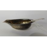 A lot comprising a silver pap boat, rubbed maker's marks, London 1770 of pear shape with gadrooned