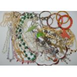 A bag full of vintage costume jewellery to include crystal, diamante, malachite beads etc