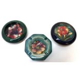 A Moorcroft Anemone pattern small dish, 11cm diameter, another in Freesia pattern, 11cm diameter and