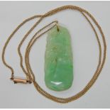 A Chinese green hardstone pendant carved with pheasants / peacocks among foliage, dimensions 4.2cm x