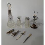 A lot comprising a silver mounted scent bottle, London 1933, a silver topped jar, a silver mounted