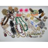 A bag full of vintage costume jewellery to include Max Neiger style beads, snake earrings,