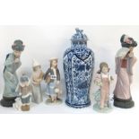 A Delft jar and cover (AF) and a collection of Lladro including two Geishas, three figures of girls,