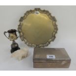 A lot comprising a silver cigarette box, London 1929, an EP card tray, a trophy cup and a resin