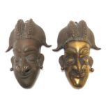 A pair of African brass wall masks, 16cm high overall (2) Condition Report: One has been polished