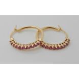 A pair of 9ct gold ruby set Creole earrings diameter approx 2cm, weight approx 3.3gms Condition