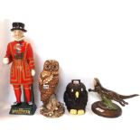 A Heredities figure of an otter, a glass model of an owl, a Royal Doulton Tawney Owl and a Carlton