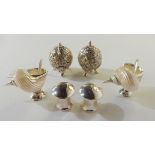 A lot comprising a pair of silver plate mounted shell salts, a pair of silver plated condiments