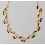 A bright yellow metal sapphire and pearl necklace, length 38cm, weight 18.5gms Condition Report: One