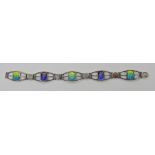 A silver and enamel Arts & Crafts bracelet by James Fenton length 17cm Condition Report: Areas of