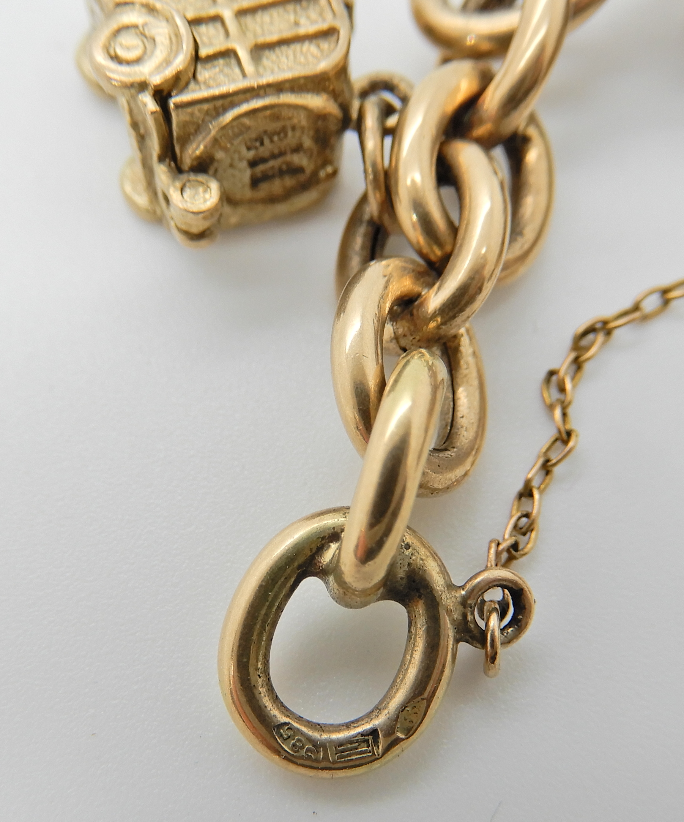 A 14ct gold curb chain bracelet hung with seven 9ct, three 14ct, two 18ct and two yellow metal - Image 2 of 2