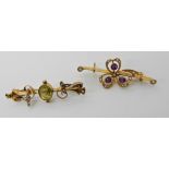 A 9ct gold green gem and pearl brooch and a 15ct gold amethyst and pearl brooch (af), weight for