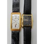 An 18ct gold ladies Gucci watch with 'tank' shaped case dimensions 3.5cm x 2.5cm and black leather