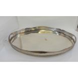 An oval silver plated twin handled galleried serving tray, 61cm x 41cm Condition Report: Available