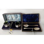 A cased pair of silver grapefruit spoons, Sheffield 1905 and a silver cased condiment set, Chester