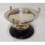 An early 20th Century triple handled bowl on wooden plinth, Sheffield hallmarks, 25cm diameter x