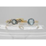 An 18ct gold aquamarine and diamond ring size P and an 18ct gold blue gem set ring size R1/2, weight