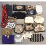 A collection of ladies evening bags including beaded, petit point, tapestry and other examples