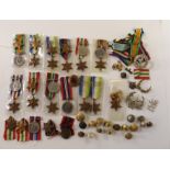 A collection of WWII medals and stars with a quantity of badges and buttons (a lot) Condition