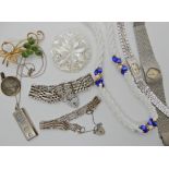 A silver ingot pendant, two silver gate bracelets and other items Condition Report: Available upon