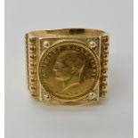 A 14ct gold ring set with a small gold Turkish coin 15mm diameter finger size 6, weight 6.7gms