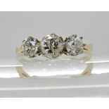 A bright yellow metal three stone diamond ring of estimated approx 1ct, finger size Q, weight 2.9gms