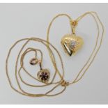 A 9ct gold heart shaped locket 2.8cm x 2cm and chain 45cm long, together with a 9ct gold garnet