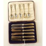 A lot comprising a cased set of six silver handled butter knives, Sheffield 1927 and five silver