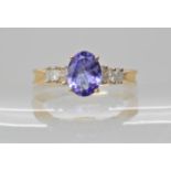 A 9ct gold tanzanite and diamond ring, tanzanite approx 7.8mm x 5.9mm, finger size O, weight 3gms