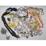 A bag full of vintage costume jewellery to include Charel, a fine beaded necklace and other items