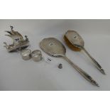 A tray lot of silver and EP - a brush and mirror set, Birmingham 1929, silver napkin ring, EP napkin