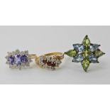 A 9ct tanzanite and clear gem cluster ring, size M, a 9ct gold red and clear gem ring size O, weight